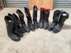 Five pairs of leather motorcycle boots.