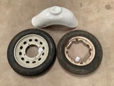 Two scooter wheels including one for a Capri scooter and a new old stock Triumph Tina front mudguard