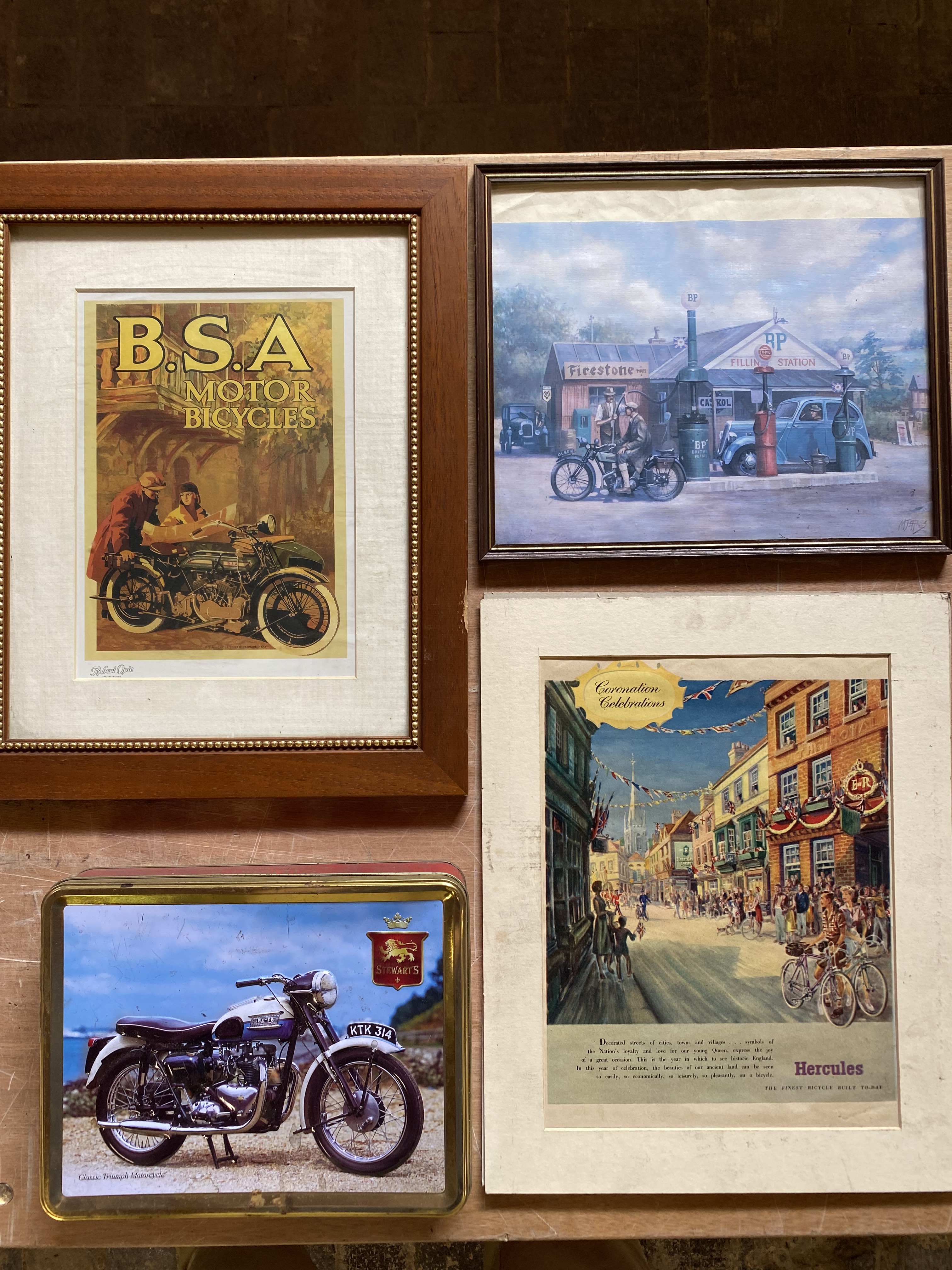 A framed and glazed reproduction BSA Motor Bicycles advertisement, two others and a tin embossed