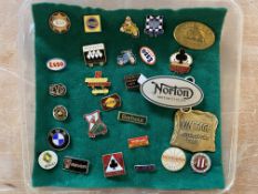 A selection of lapel badges including BSA, Esso, Levis, Triton etc.