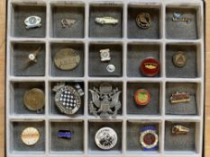 A selection of lapel badges including Douglas, plus an Austin supply plate