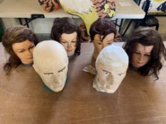 Four mannequin heads and two others, ideal for displaying hats and helmets.