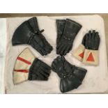 Five pairs of classic motorcycle gauntlets.