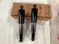 A pair of new old stock dampers 12 1/2" eye to eye.