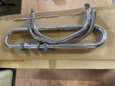 Two new old stock BSA A7/A10 silencers, boxed and BSA crash bars.