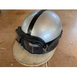 An Everoak racing helmet with peak, and goggles