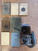 A Jap engine plus assorted motorcycle books.