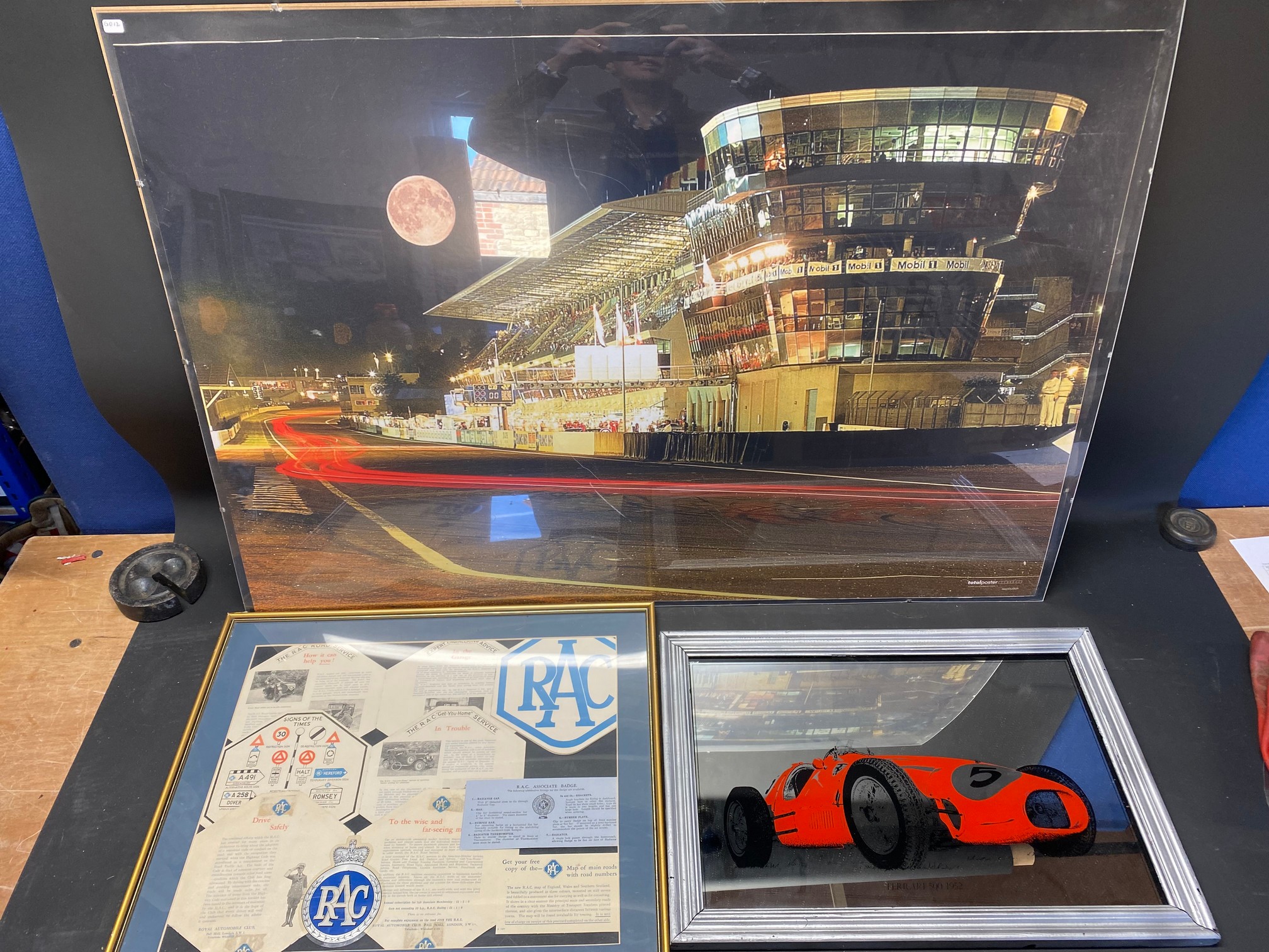 A framed and glazed collage of original RAC epherera, a Ferrari advertising mirror and a large scale