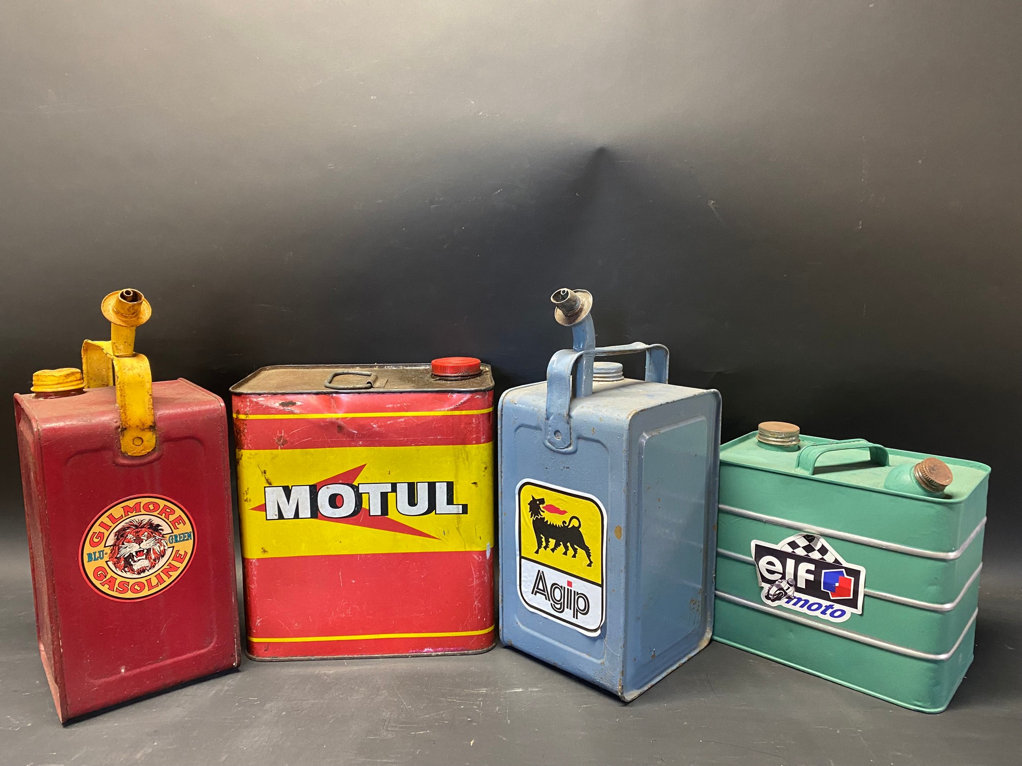 Four assorted oil cans.