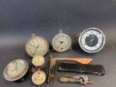 A box of assorted instruments to include speedometers and various other parts.