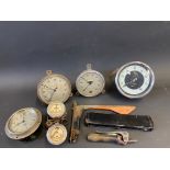 A box of assorted instruments to include speedometers and various other parts.