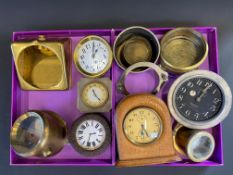 Two trays of car clocks and frames.