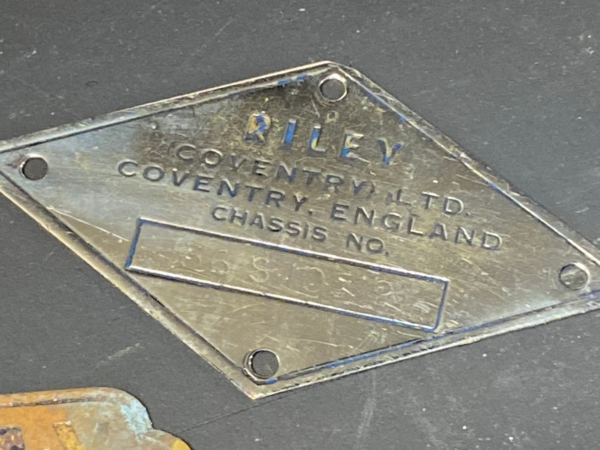 A silver plated case marked Cruss Aus Dem Rheinland, a French enamel plaque, a Riley chassis plate - Image 2 of 4