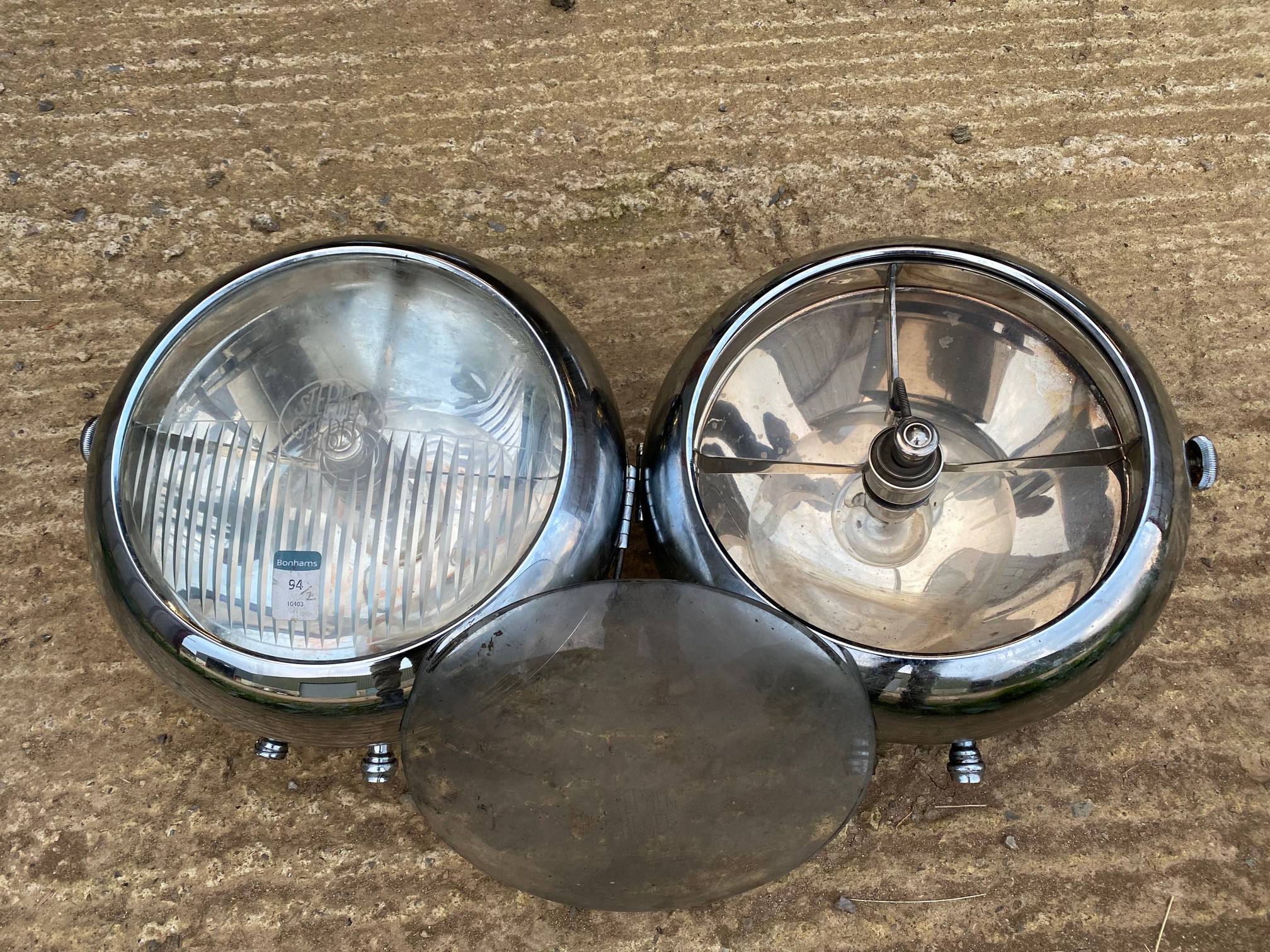 A very good pair of Stephen Grebel headlamps, one lens missing but an associated lens accompanies