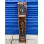 An oak cased wall clock, with decorative etched glass panel bearing Michelin advertising.