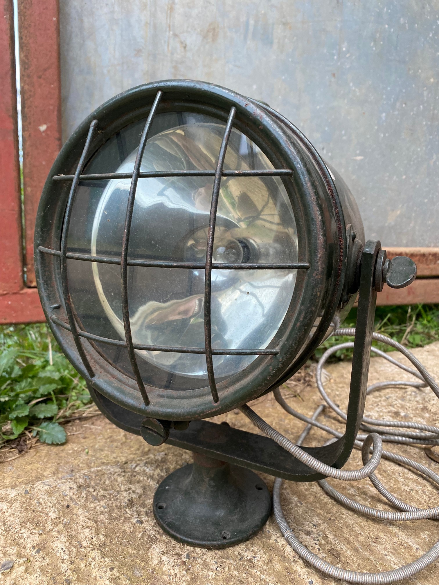 A large spotlamp in military colours.