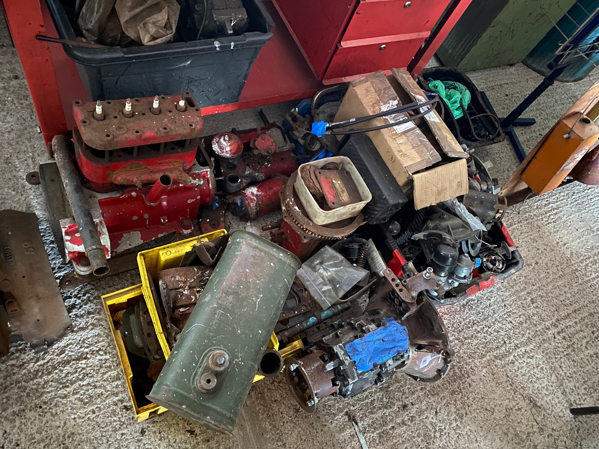 An autojumbler's lot of various mechanical parts including Austin 7 marine engine.