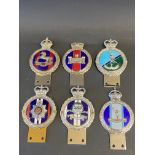 Six enamel regimental car badges.