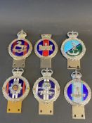 Six enamel regimental car badges.