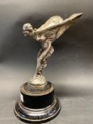 A Rolls-Royce Spirit of Ecstasy mascot to suit Silver Ghost, circa 1911-1912, display base mounted.