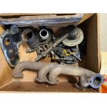 A box of mostly Austin 12/4 parts to include a circa 1928 manifold.