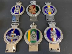 Three Gaunt enamel regimental car badges to include The Royal Gloucestershire Hussars and three