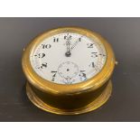 A large Edwardian brass sloping backed eight day car clock.