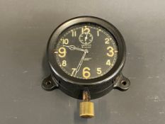 A Zenith bakelite cased eight day car clock, bottom wind.