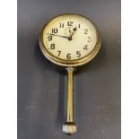 A brass eight day car clock with secondary dial and bottom wind.