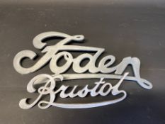 A Foden radiator script badge and a second for Bristol.