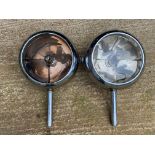 A pair of Stephen Grebel headlamps, one lens missing, approx. 10" diameter.