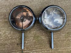 A pair of Stephen Grebel headlamps, one lens missing, approx. 10" diameter.