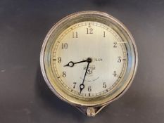 A Smiths rim-wind eight day car clock, appears restored.