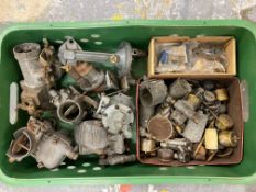 A tray of carburettors, fuel pump and parts.