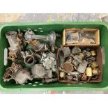 A tray of carburettors, fuel pump and parts.