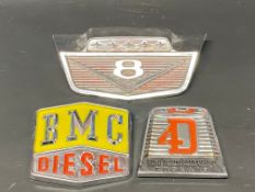 A BMC Diesel radiator plaque and two others including Ford.