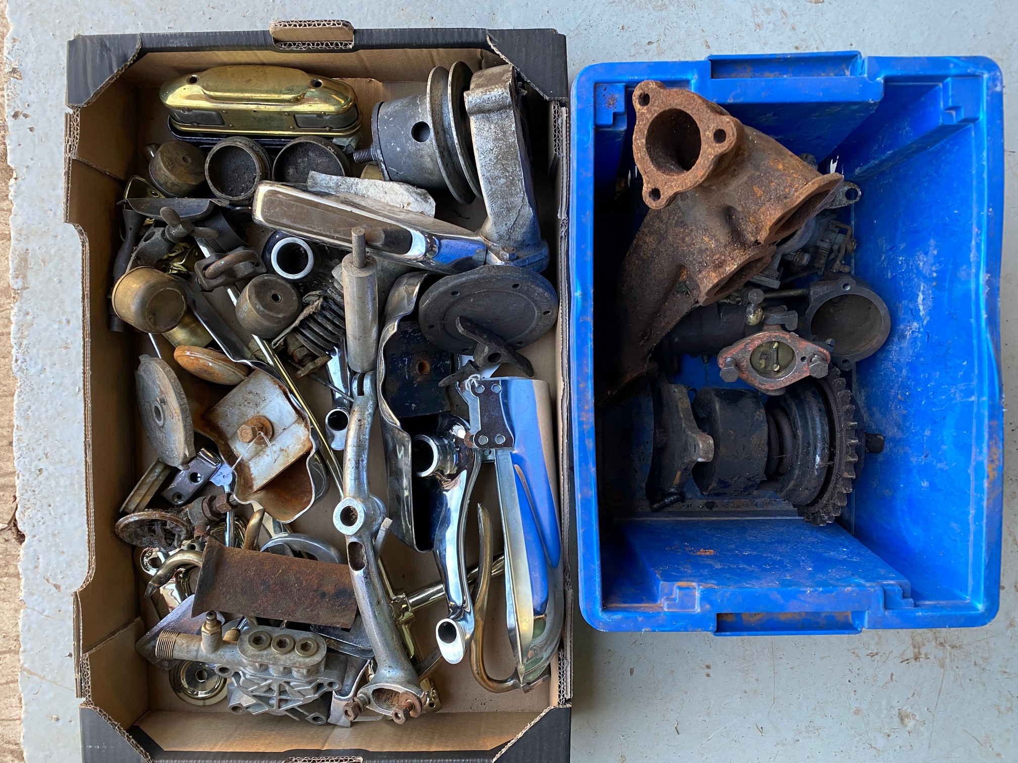 Two boxes of car parts including some to suit Edwardian/vintage cars.