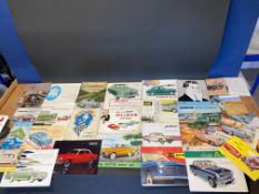 A collection of assorted sales brochures, mainly British 1960s cars including Hillman, Sunbeam,