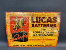 An early Lucas Batteries tin advertising sign with image of a figure on a horse standing on a