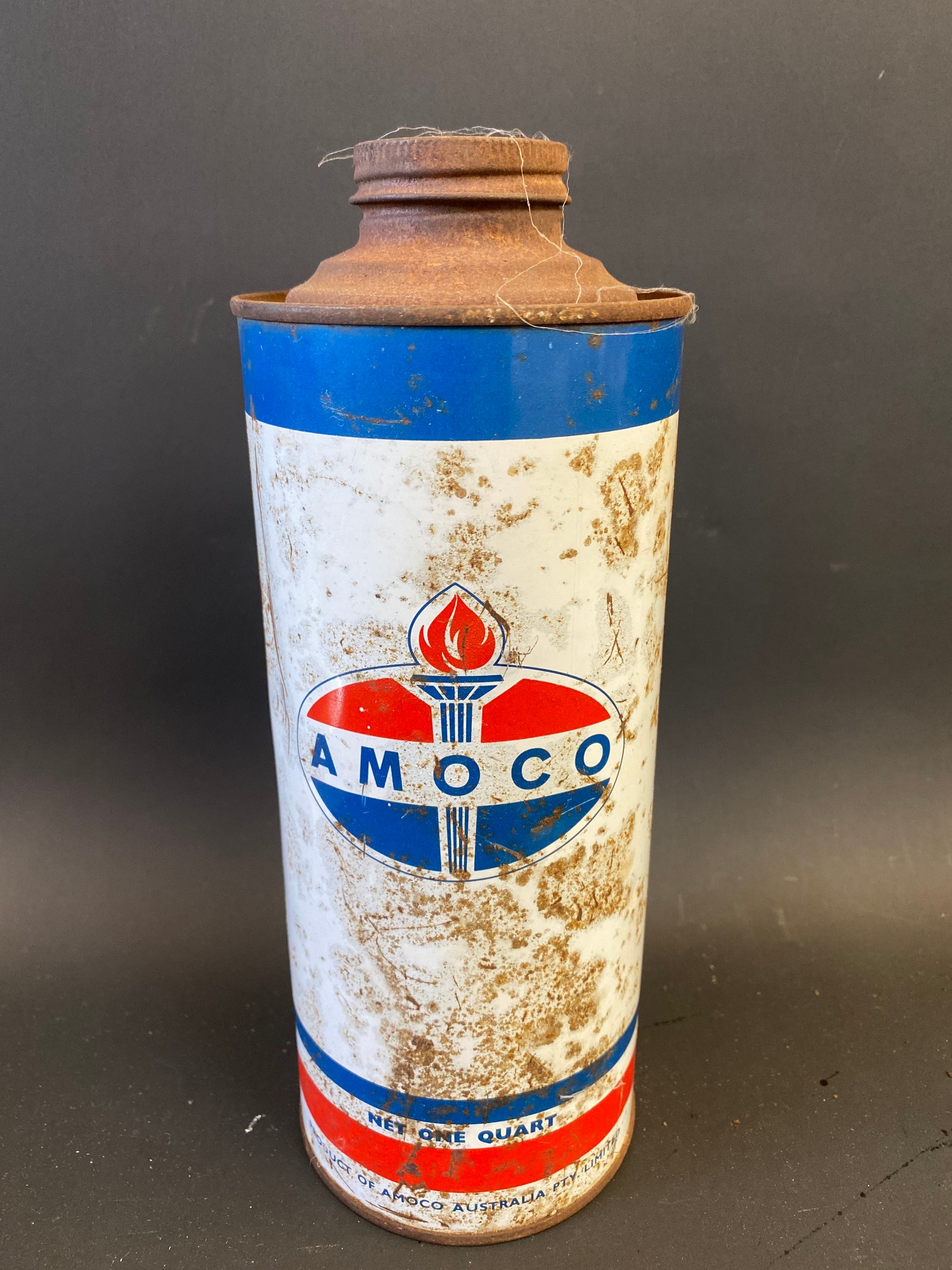 An Amoco cylindrical quart can.