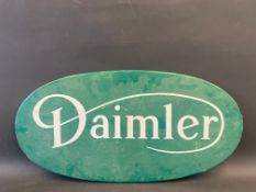 A Daimler oval wooden sign, 35 3/4 x 17 3/4".