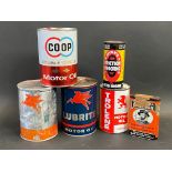 A selection of assorted oil cans including Mobil, Trolene etc.