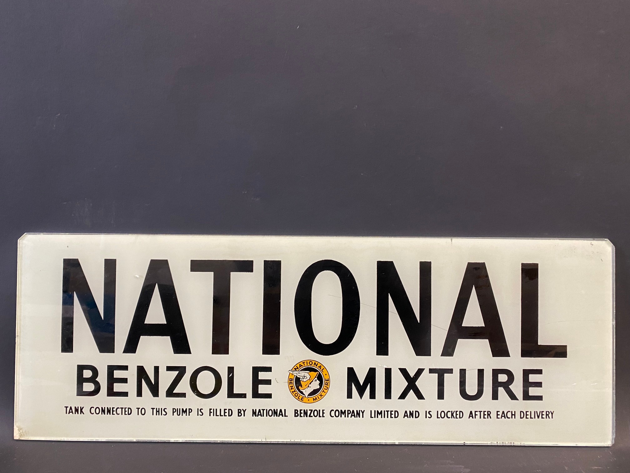 A National Benzole Mixture glass petrol pump brand indicator, 20 x 7".