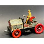 A superb German tinplate clockwork model of a veteran motor car by Marke, bearing the name Hessmobil