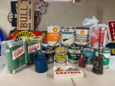 A selection of later oil cans, Castrol rack etc.