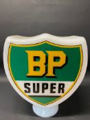 A reproduction BP Super shield-shaped glass petrol pump globe.