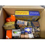 A box of assorted car bulbs in original packaging plus an Endura Lamps rectangular tin.