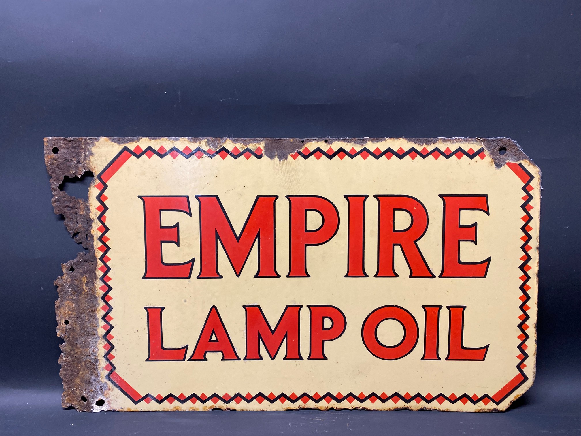 An Empire Lamp Oil double sided enamel sign with flattened hanging flange, 26 x 15".