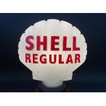 A rare Shell Regular glass petrol pump globe by Hailware, repainted letters and repaired damage to