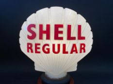 A rare Shell Regular glass petrol pump globe by Hailware, repainted letters and repaired damage to